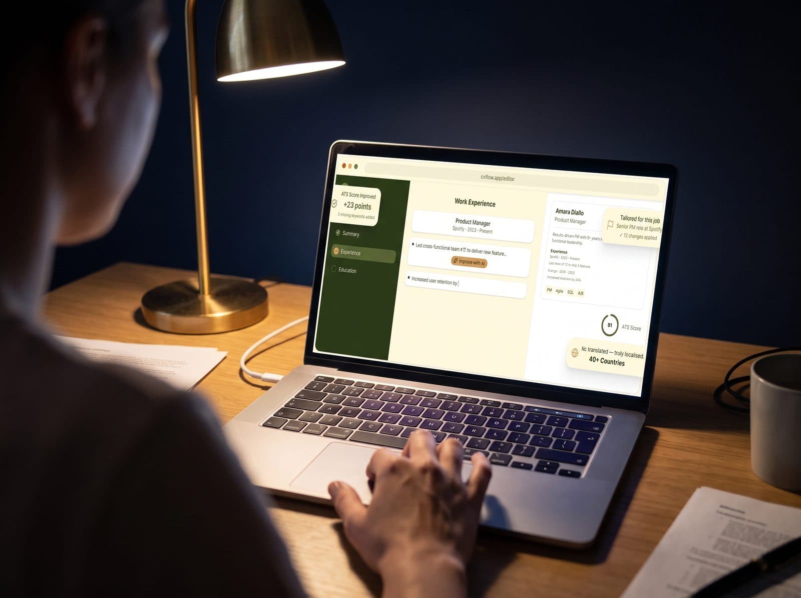 The CVFlow CV editor open on a laptop under a desk lamp in the evening